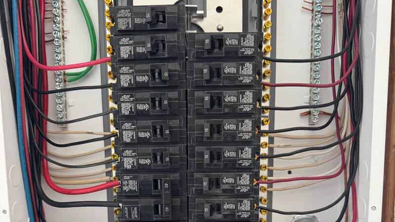 Residential electrical panel with circuit breakers and wiring